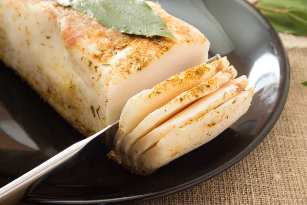 Lard with laurel leaf on a plate — Stock Image Lard with laurel leaf on a plate Stock Image