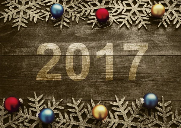 Felice anno nuovo 2017 su uno sfondo di legno. Numero 2017 su sfondo texture in legno stile vintage . — Foto Stock