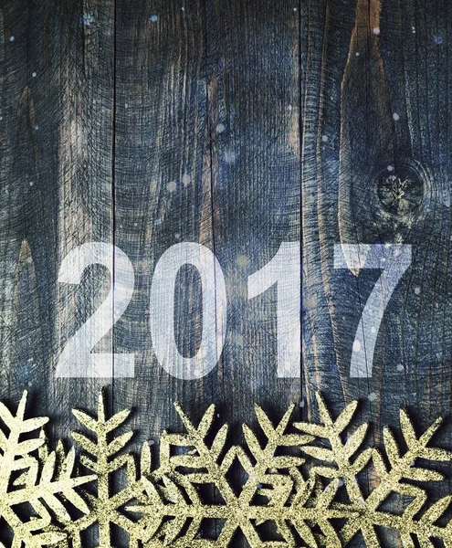 Feliz Año Nuevo 2017 sobre un fondo de madera. Número 2017 en estilo vintage textura de madera de fondo . —  Fotos de Stock