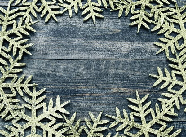 Christmas wooden background with decorative snowflakes. View with copy space. — Stock Photo, Image