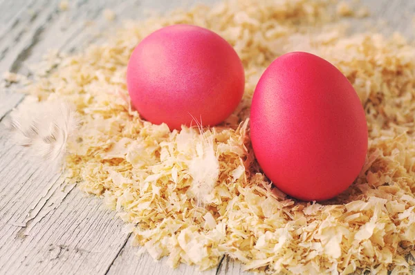 Easter eggs on wood sawdust — Stock Photo, Image