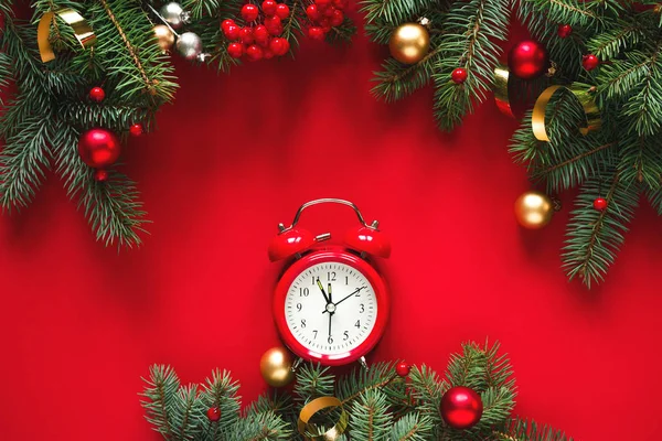 Fir Branches Holiday Decorations Red Vintage Alarm Clock Red Background — Stock Photo, Image