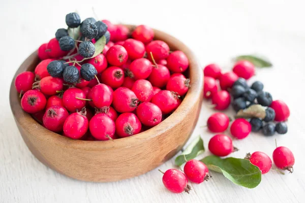 Fresh Red Berries Hawthorn Chokeberry Wooden Bowl White Table Surface — Stok fotoğraf