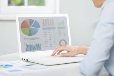 Business woman working on financial report 