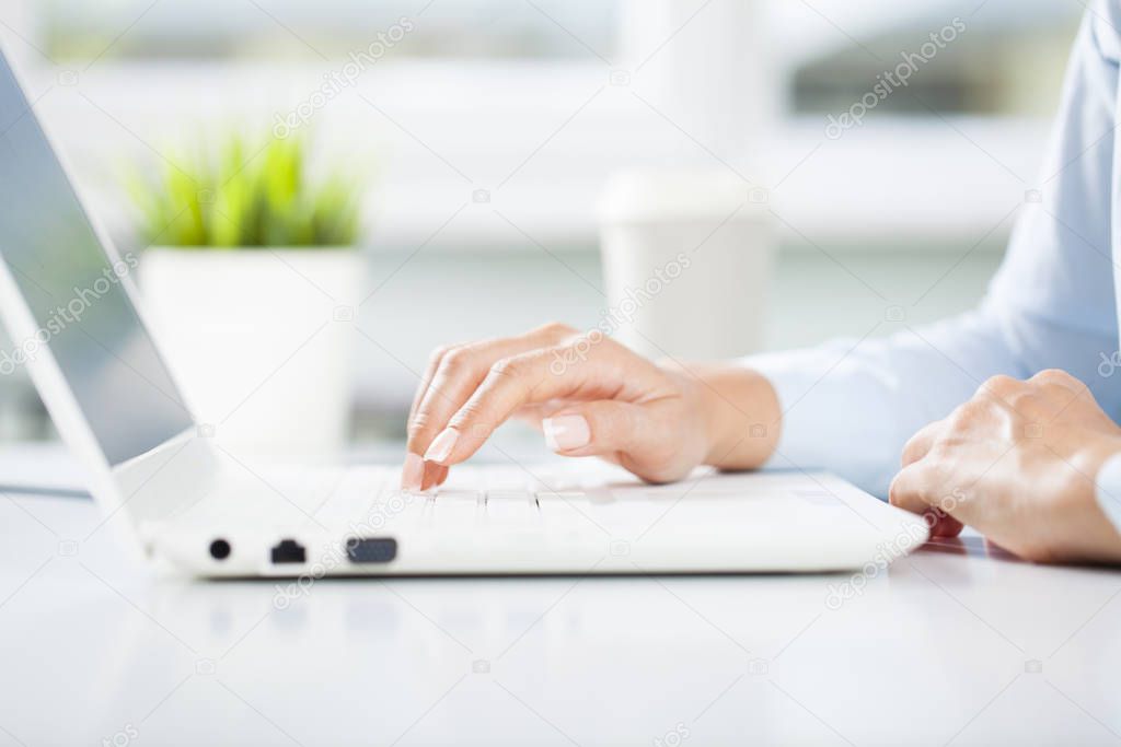 Young business woman working using lapto