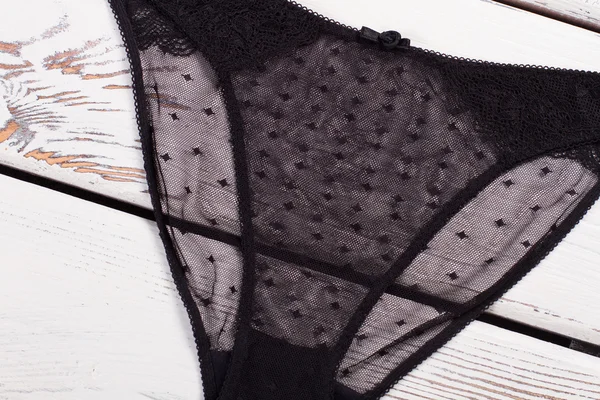 İç çamaşırı üzerinde ahşap arka plan.