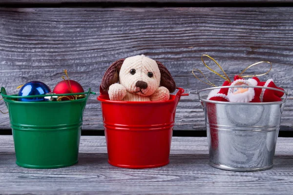 Christmas toys in buckets. — Stock Photo, Image