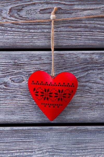 Beautiful wooden red heart with ornaments. 