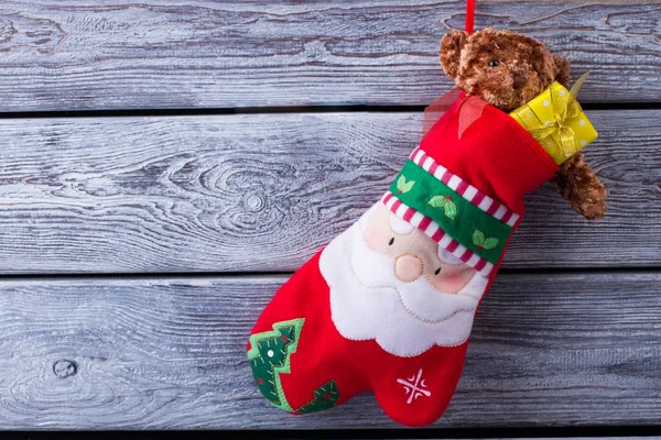 Christmas gifts in the mitten. — Stock Photo, Image