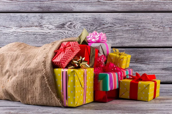 Large old bag with Christmas presents. — Stock Photo, Image