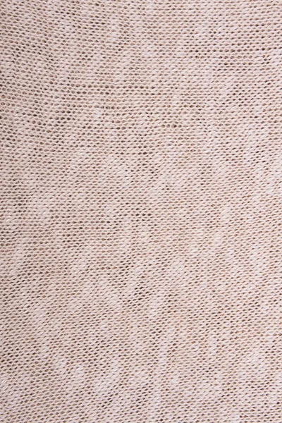 Bej örme kumaş doku.