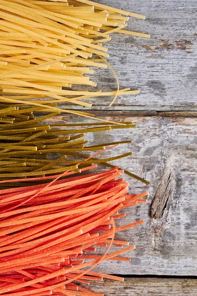 Italian spaghetti of different colors.