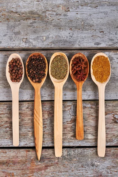 Seasoning in wooden spoons. — Stock Photo, Image