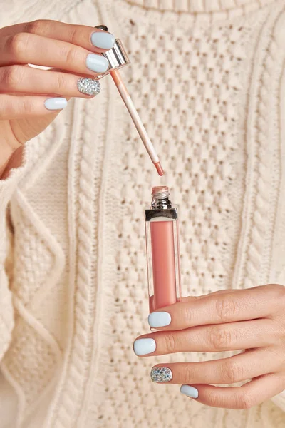 Gentle female blue manicure.