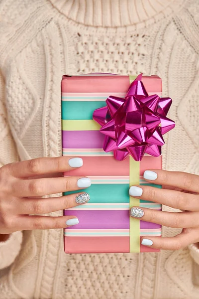 Beautiful gift box in bright stripes. — Stock Photo, Image