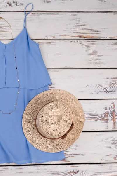 Summer blouse, hat in pastel color.