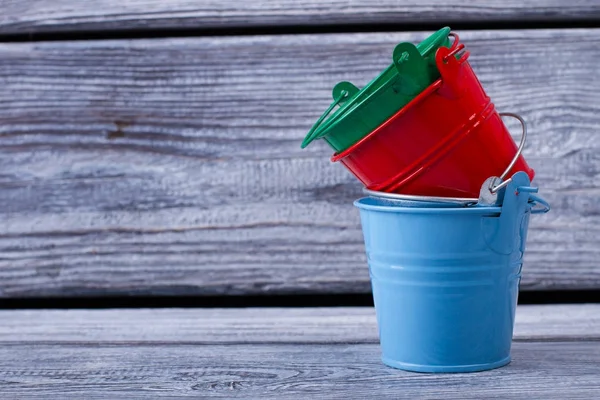 Set of colored metal buckets — Stock Photo, Image