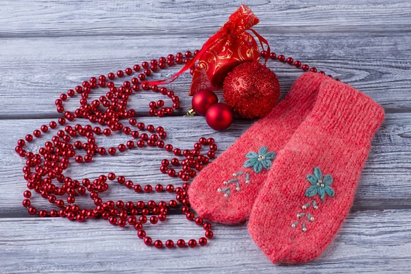Red mittens and Christmas ornaments — Stock Photo, Image