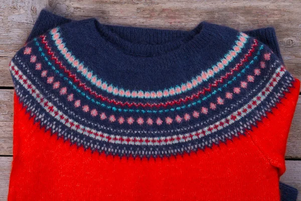Red sweater with Icelandic pattern