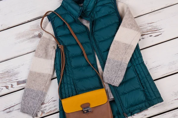 Quilted vest and woolen sweater