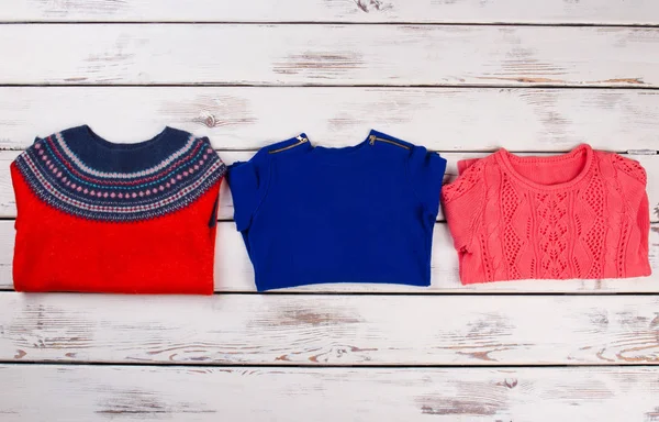 Bright red and blue sweaters — Stock Photo, Image