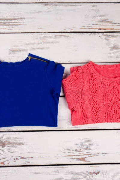 Red and blue sweaters