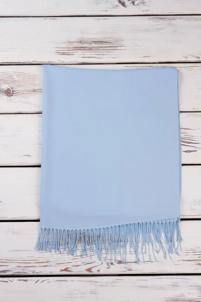 Folded light blue cashmere scarf