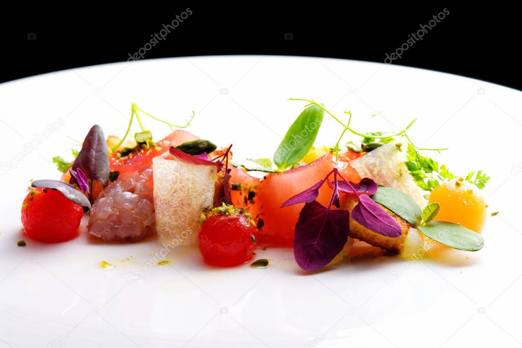 Haute cuisine appetizer with tuna tartare, watermelon and spices