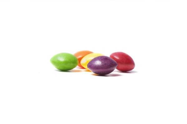 Peu de petits bonbons ronds colorés — Photo
