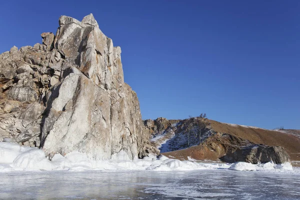 Shamanka rock. Lake Baikal. Winter landscape