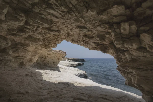 Пещера. Rocks near Governor 's beach, Cyprus landscape — стоковое фото