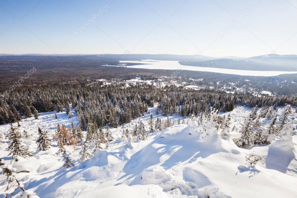 View of lake Zuratkul from Mountain range. Winter landscape. 