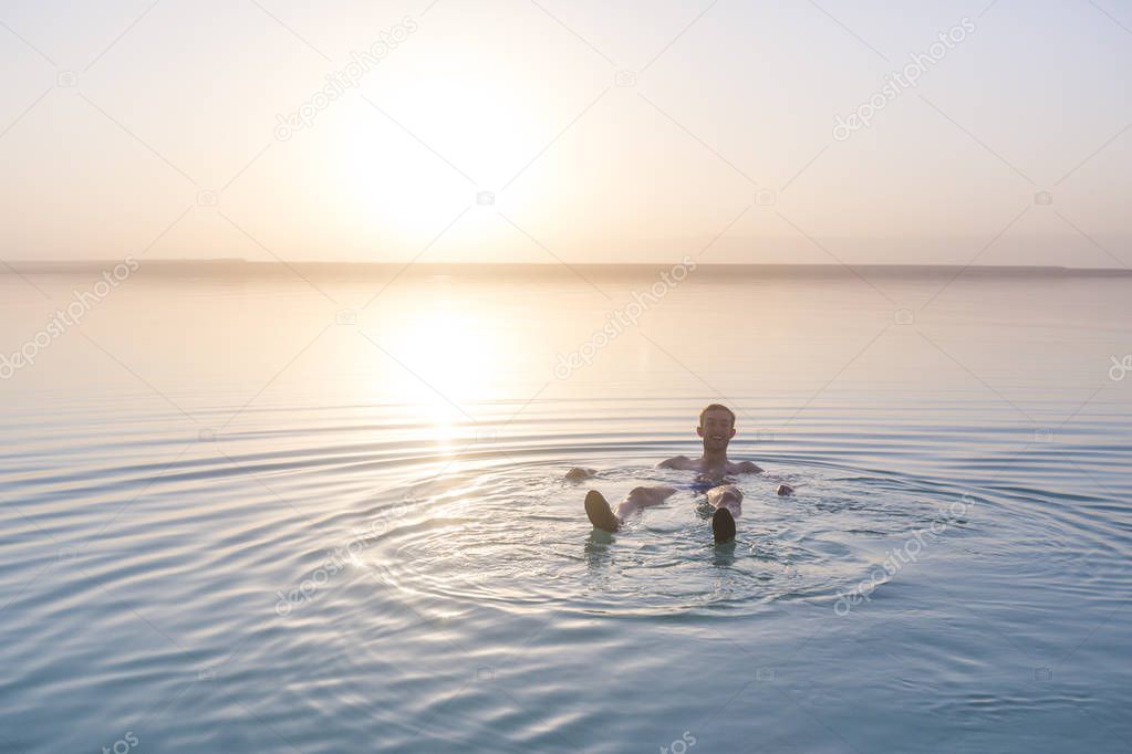 Tourist swims in Dead Sea. Jordan 