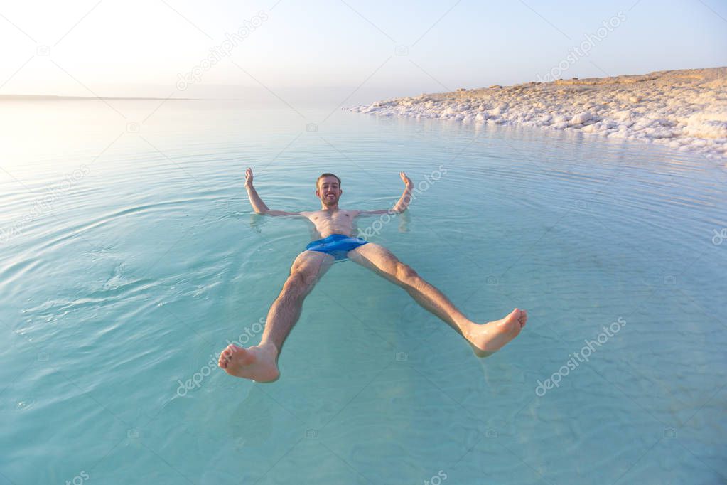 Tourist swims in Dead Sea. Jordan 
