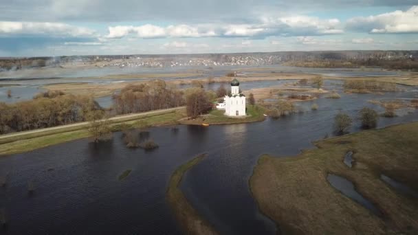 Church of the Intercession on the Nerl. Vladimir region, Russia. Aerial view spring landscape — Stock Footage Church Intercession Nerl Vladimir Region Russia Aerial View Spring Landscape Stock Video
