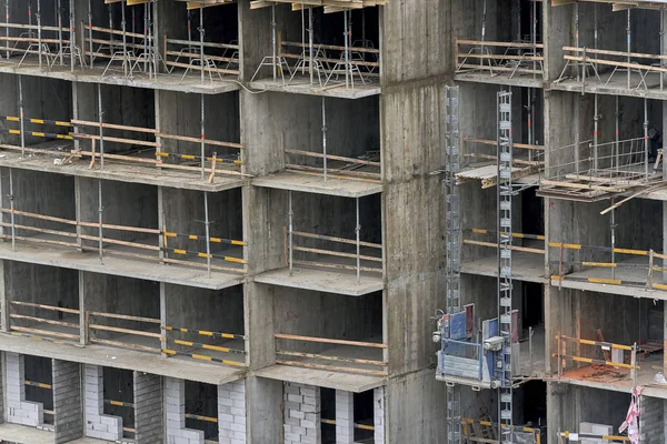 Fragment of under construction apartment building. The front of — Stock Photo, Image