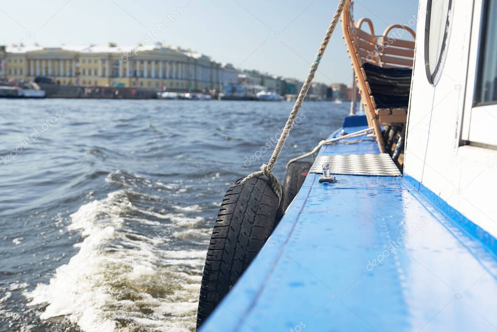 A fragment of a pleasure craft in the background of the sights of St. Petersburg. Russia, Neva river