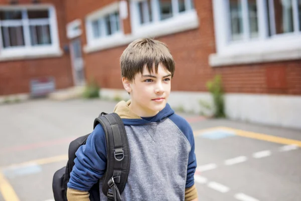 Nice Pre-teen boy outside at school having good time — Stock Photo, Image