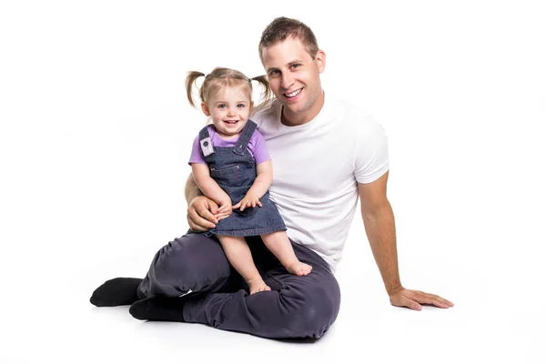 Father and daughter lay on ground having fun — Stock Photo, Image
