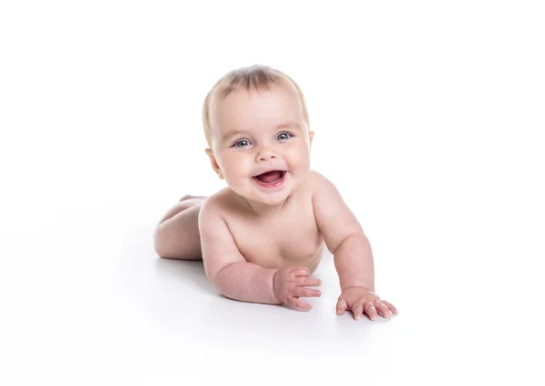 Dolce bambina sul pavimento dello studio sfondo bianco — Foto Stock