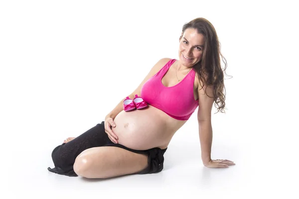 Беременная женщина брюхо на белом фоне — стоковое фото