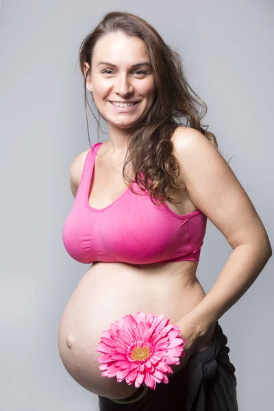 Pregnant woman belly over white background — Stock Photo, Image