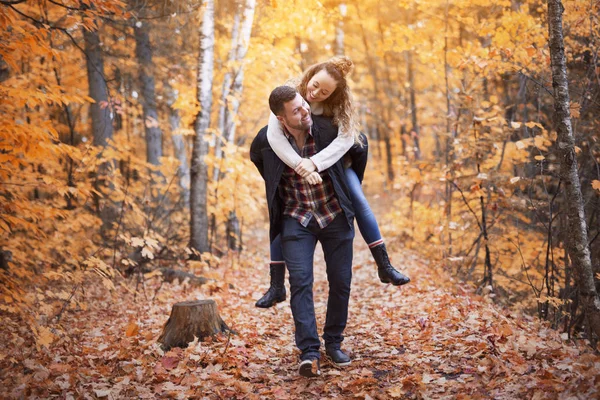 Nice couple having fun in autumn park — Stock Photo, Image
