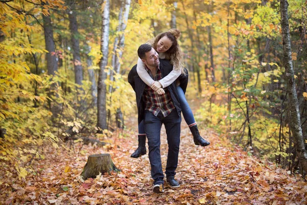 Nice couple having fun in autumn park — Stock Photo, Image