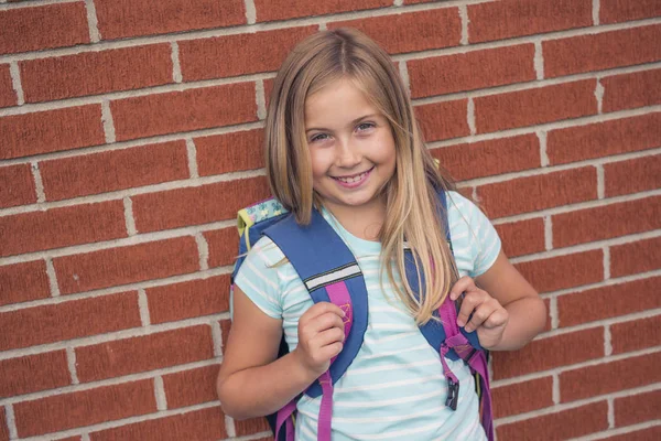 Nine years old girl student at school — Stock Photo, Image