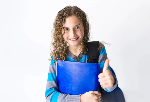 Girl of 9 years in a school uniform poses in studio. — Stock Photo, Image