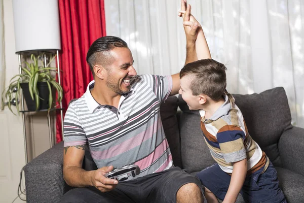 Father and son playing video game — Stock Photo, Image