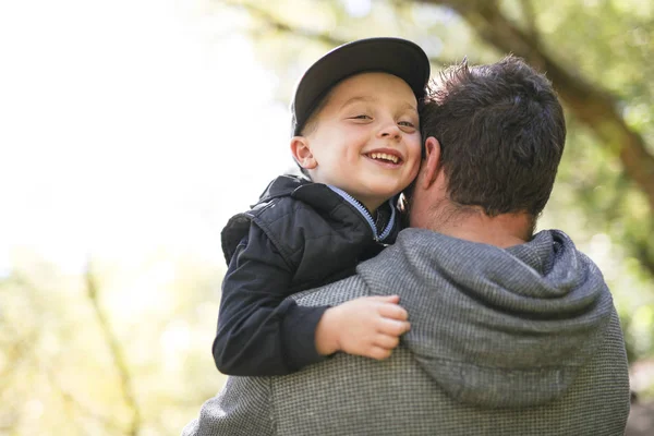 Father and son in forest on a meadow — Stock Photo, Image