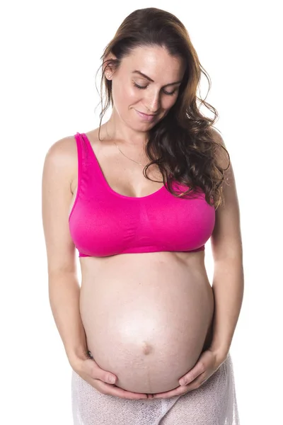 Mujer embarazada vientre sobre fondo blanco —  Fotos de Stock