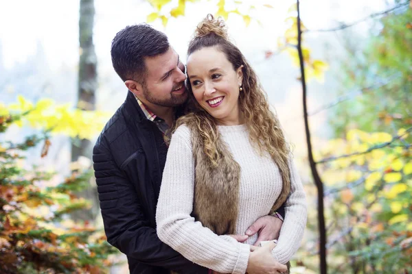 Nice couple having fun in autumn park — Stock Photo, Image